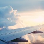 Aerial view of an airliner in flight, representing redeeming airline miles for award travel