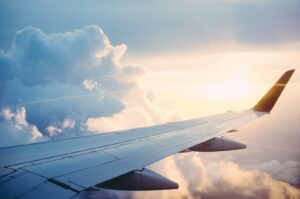 Aerial view of an airliner in flight, representing redeeming airline miles for award travel