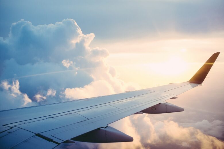 Aerial view of an airliner in flight, representing redeeming airline miles for award travel