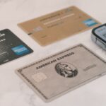 Credit cards next to a phone, representing tracking a balance transfer deadline