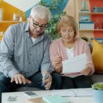 Retired couple reviewing their finances and credit card options together