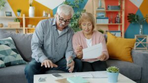 Retired couple reviewing their finances and credit card options together