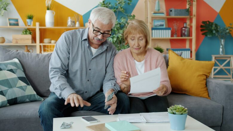 Retired couple reviewing their finances and credit card options together